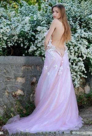 Beautiful girl Elle Tan slips off wedding dress to pose nude in garden on girlsfollowers.com