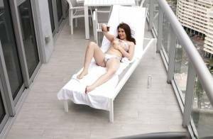 Brunette teen Kylie Quinn caught masturbating on balcony by voyeur on girlsfollowers.com