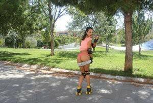 Latina solo girl Carolina Abril shedding shorts to expose nice ass outdoors on girlsfollowers.com