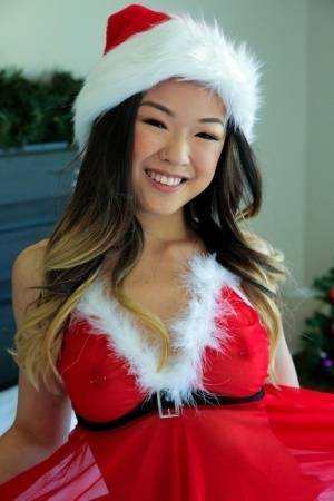 Cute Asian teen Lulu Chu wears Xmas lingerie during sex on a bed on girlsfollowers.com