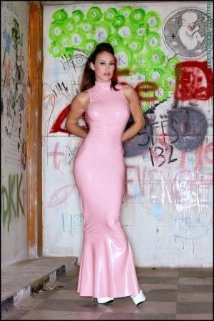 Latina beauty Ryan Keely inserts a vibrator after removing a long latex dress on girlsfollowers.com